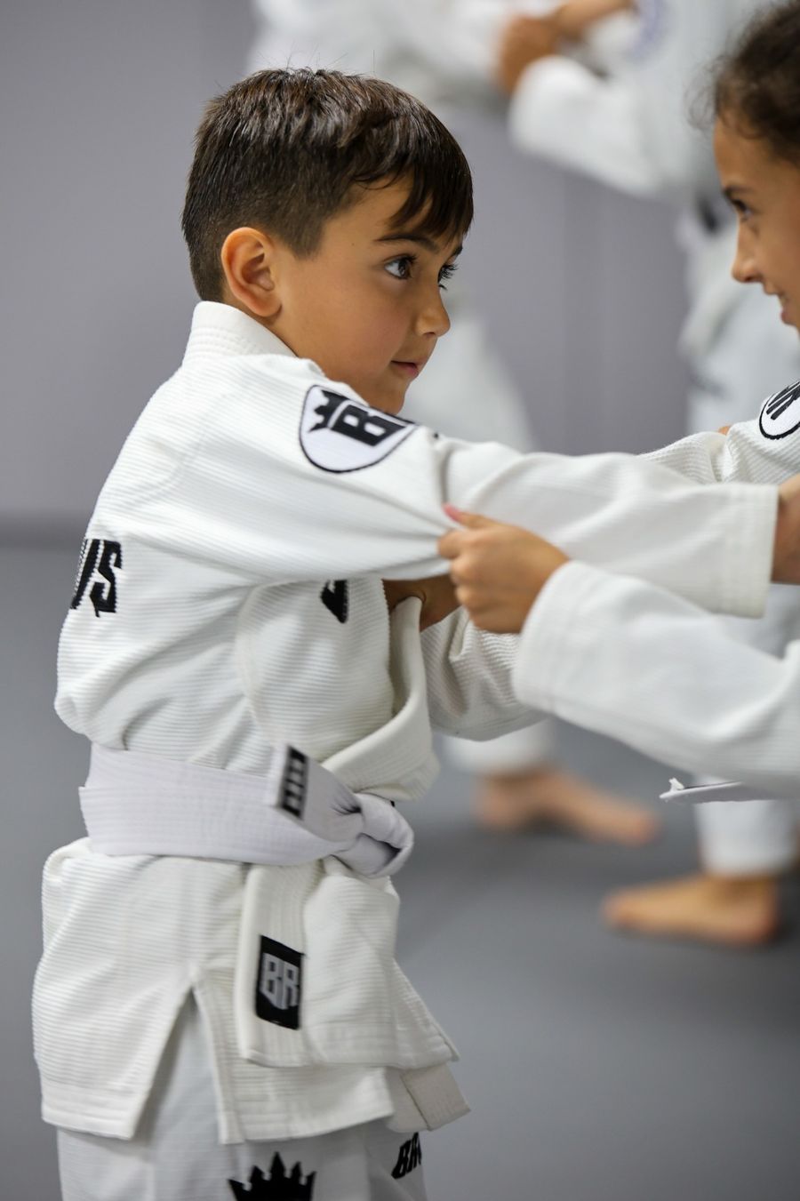 A child training Brazilian Jiu-Jitsu at Brabus Academy